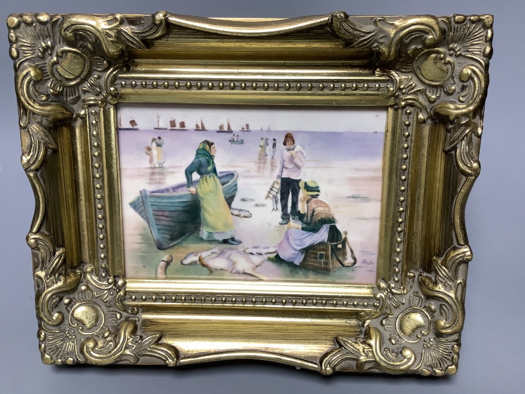 A framed porcelain plaque, painted by E.R. Booth, depicting fisherwomen at the shore, 12 x 17cm excluding frame